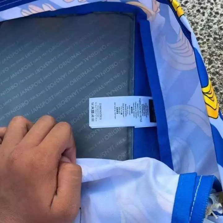 Jansport Tas Ransel Original Biru Motif Kartun Dengan Resleting Dan Label Ukuran