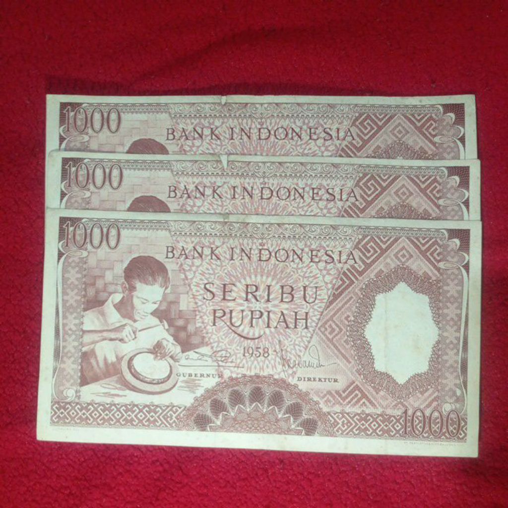 uang kertas kuno 1000 pekerja merah bekas edar