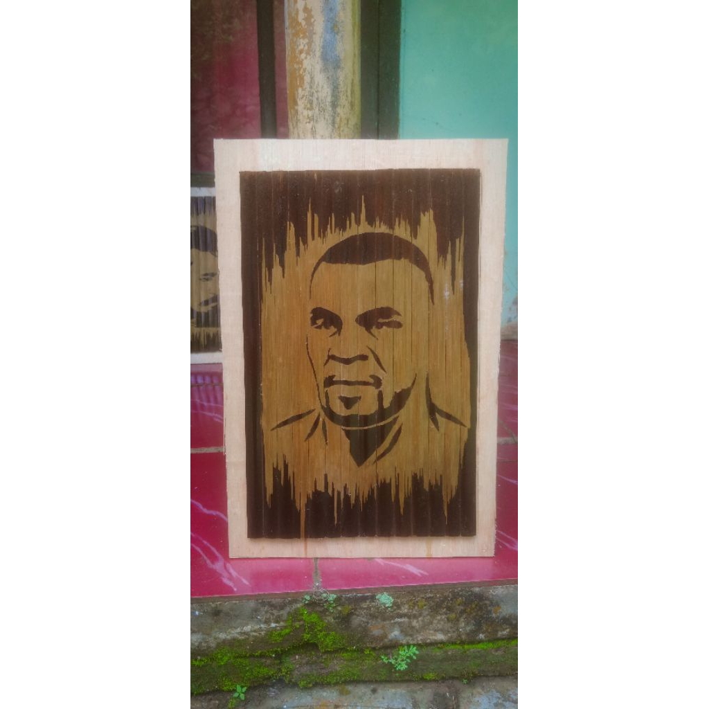 ukiran bambu hitam motif wajah