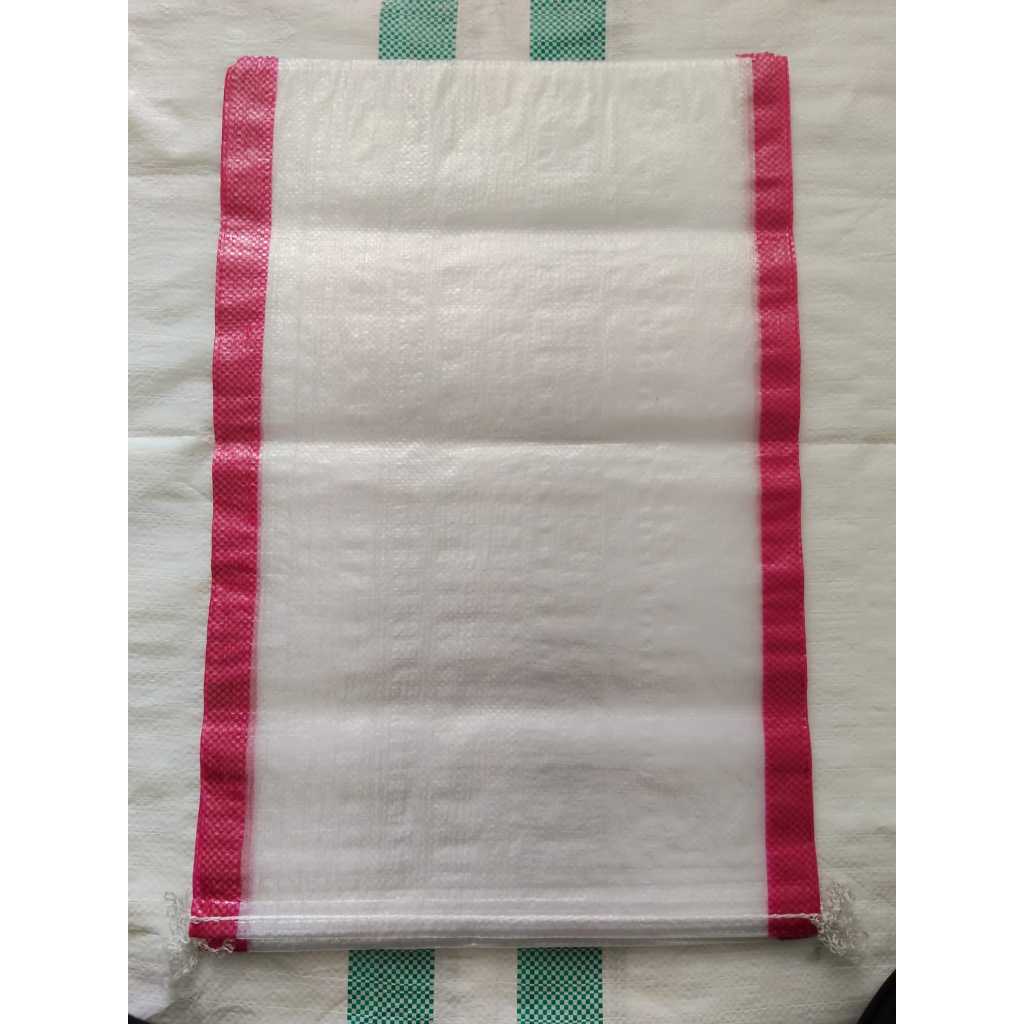 karung beras 15 kg  40x60transparan merah isi 25 lembar