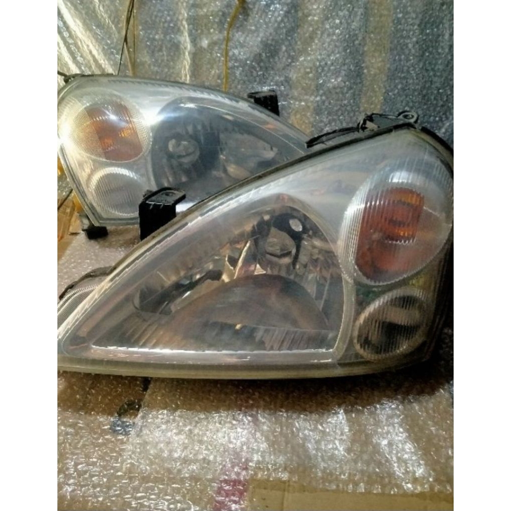 LAMPU DEPAN SUZUKI AERIO ORI
