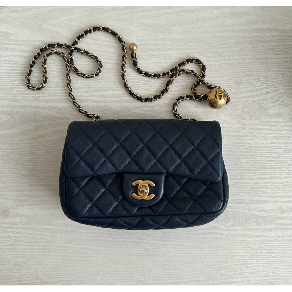 Chanel Mini Rectangular Pearl Crush Flap Bag in navy blue. 