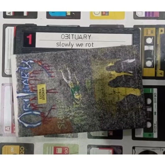 kaset pita obituary album slowly we rot