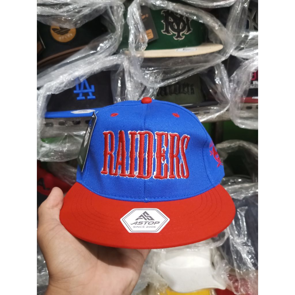 TOPI SNAPBACK RAIDERS BLUE RED