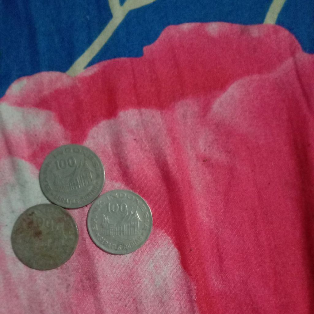 koin 100 rupiah gambar rumah gadang