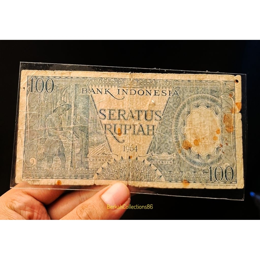 koleksi 100 rupiah seri pekerja biru tahun 1964 bekas