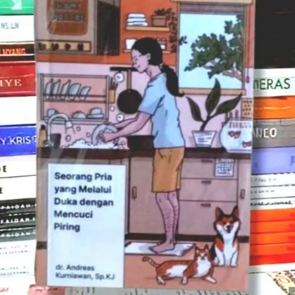 seorang pria yang melalui duka dengan mencuci piring