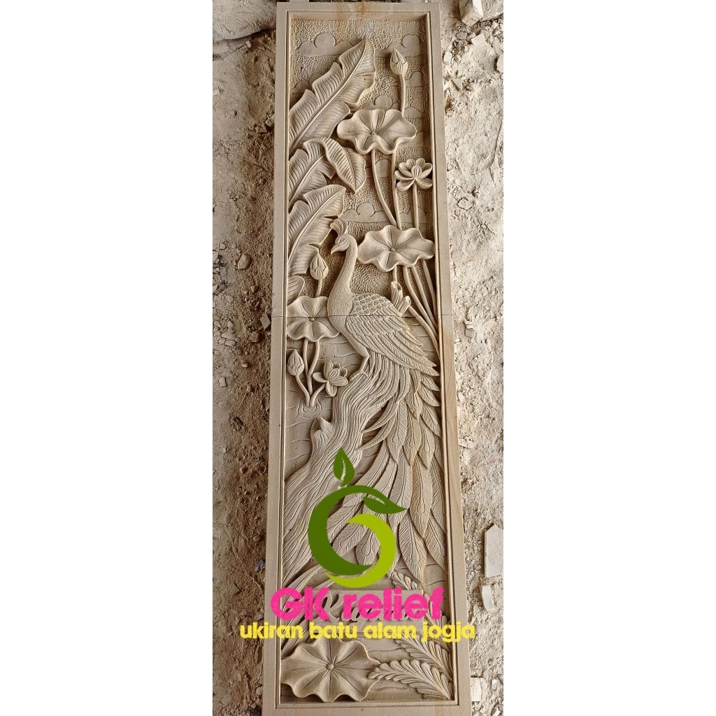 relief burung merak batu paras jogja