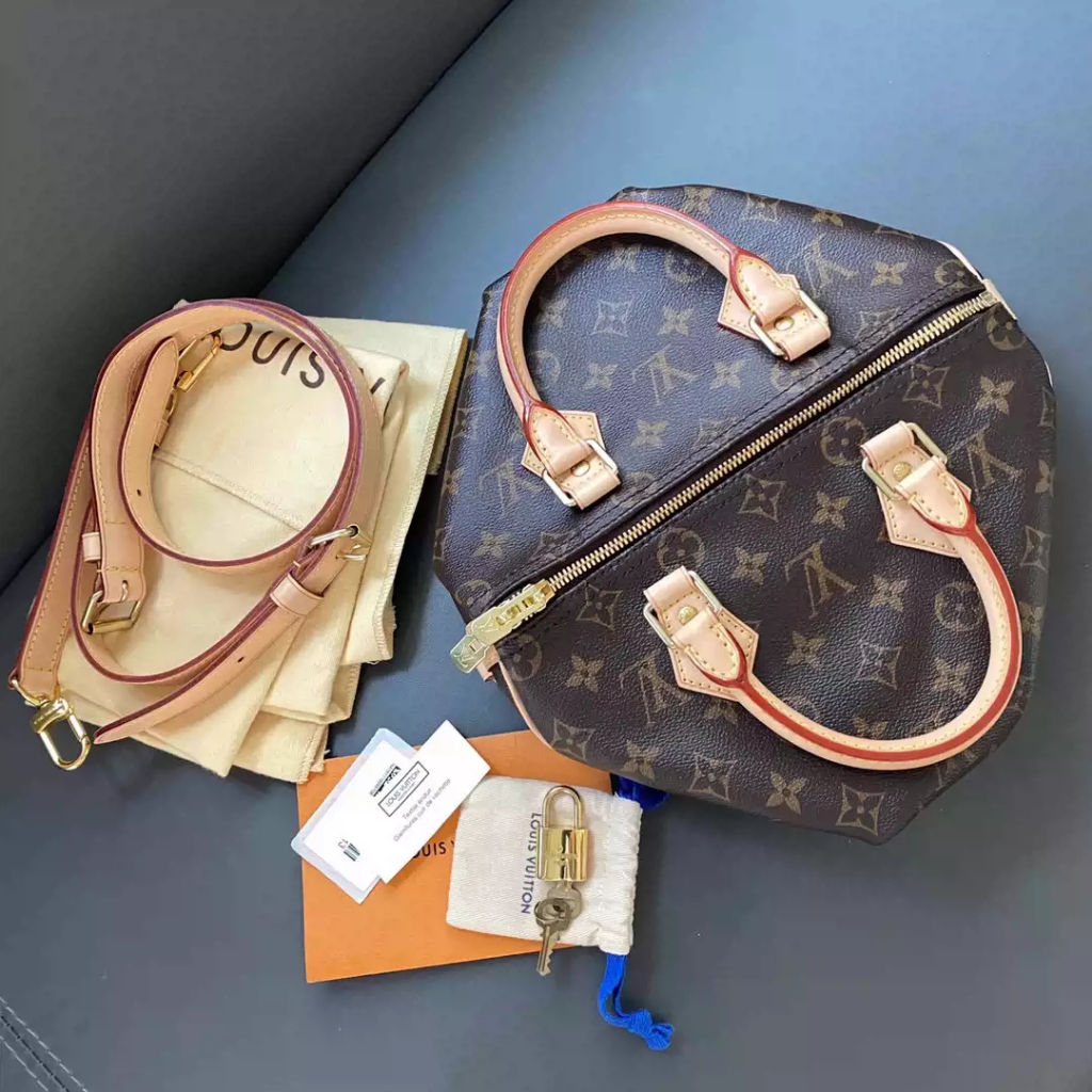 Tas Louis Vuitton Speedy 25 M41113, tas model Boston klasik dengan motif Monogram cokelat. Dikenal j