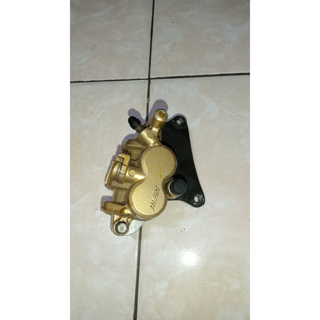 kaliper depan tiger megapro ori