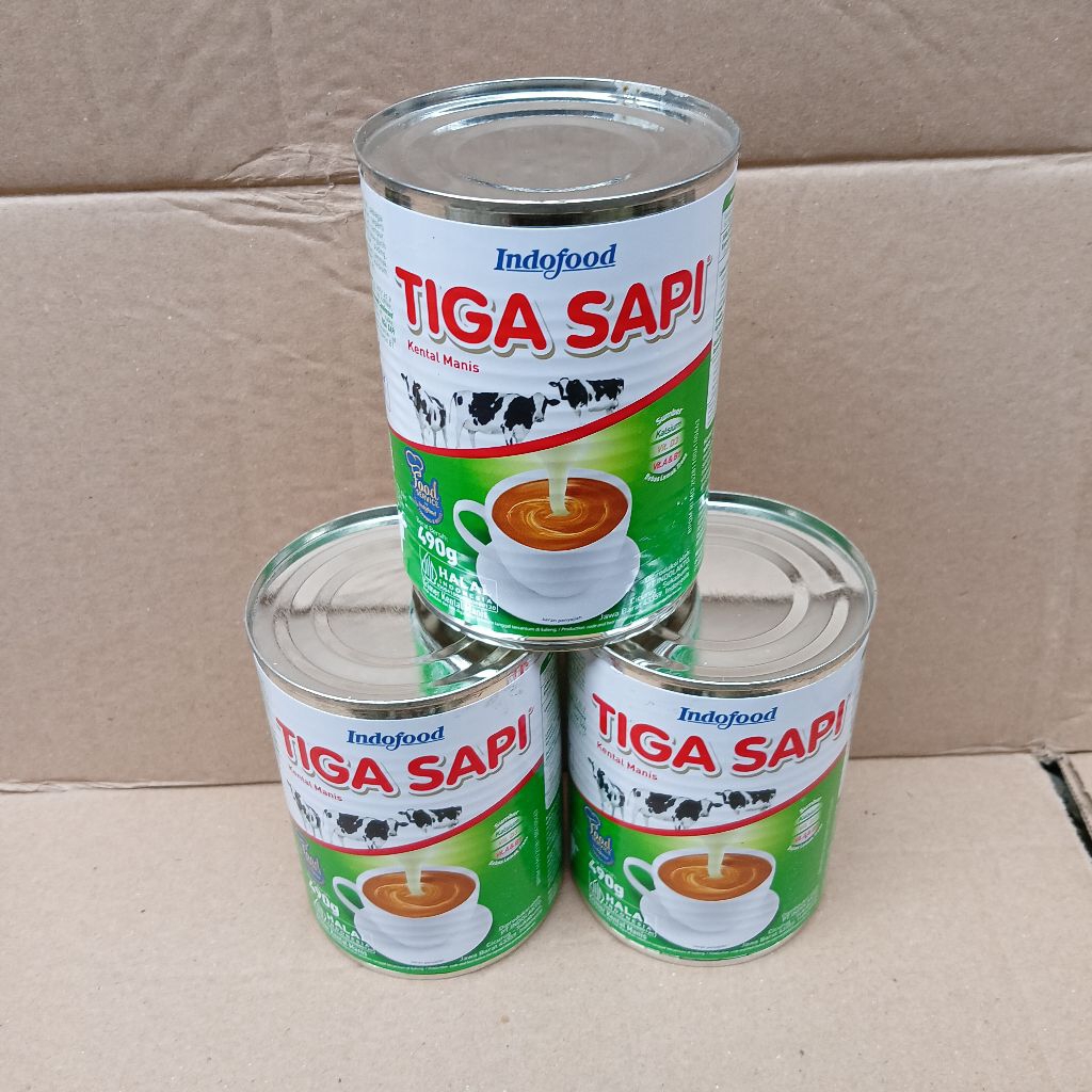 Tiga sapi krimer kental manis