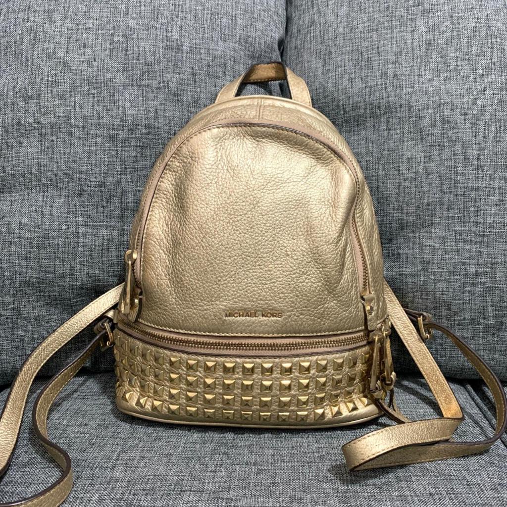 Preloved Tas Michael Kors Rhea Studded Backpack Gold Authentic Original