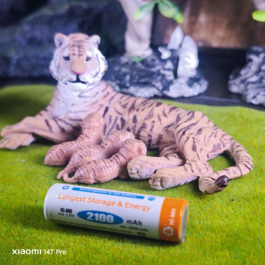 lying Tigress with baby harimau figure