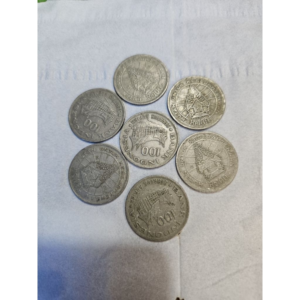 100 rupiah.rumah gadang