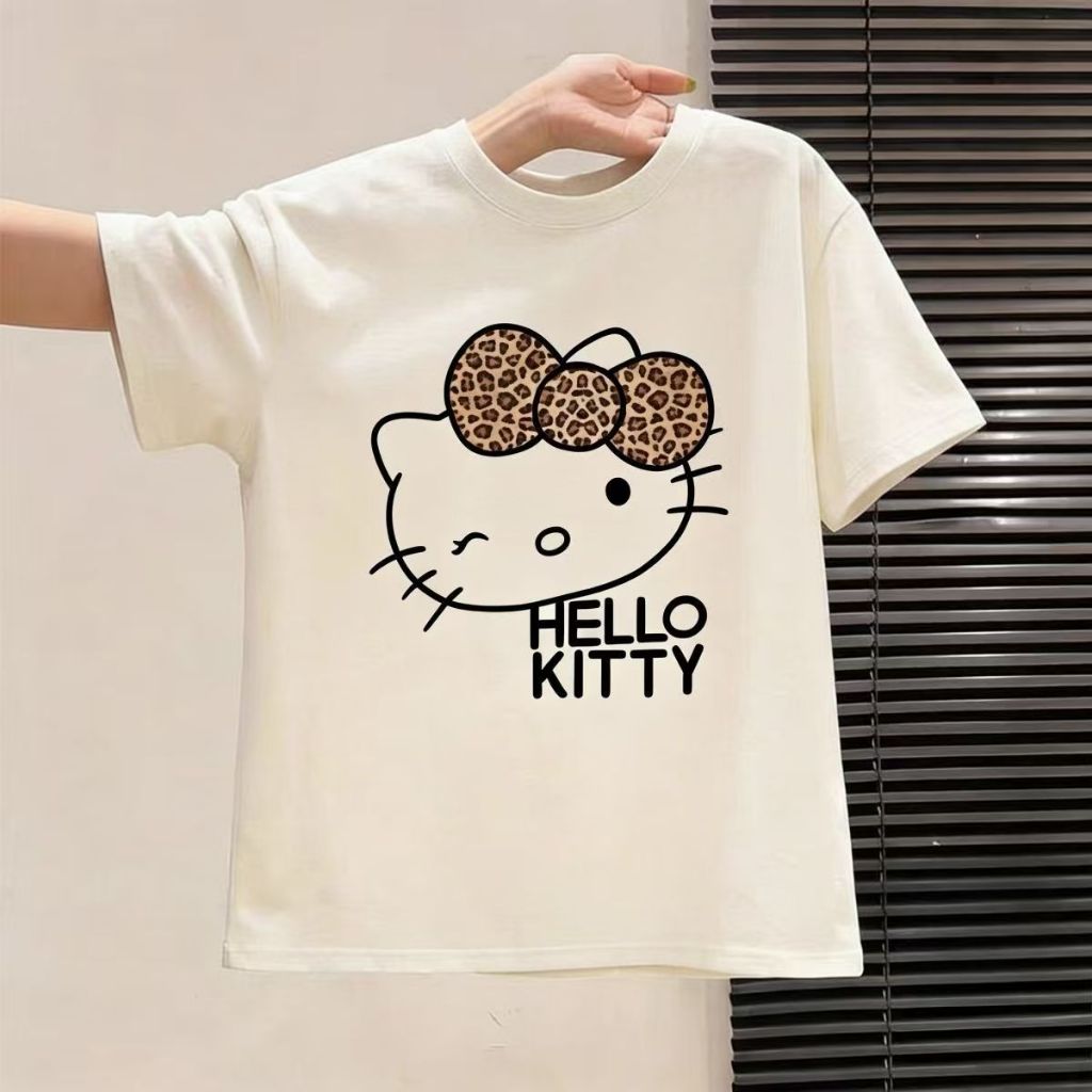 Kaos Wanita Oversize Putih Motif Wajah Kartun dengan Pita Motif Macan Tutul | Baju Atasan Santai