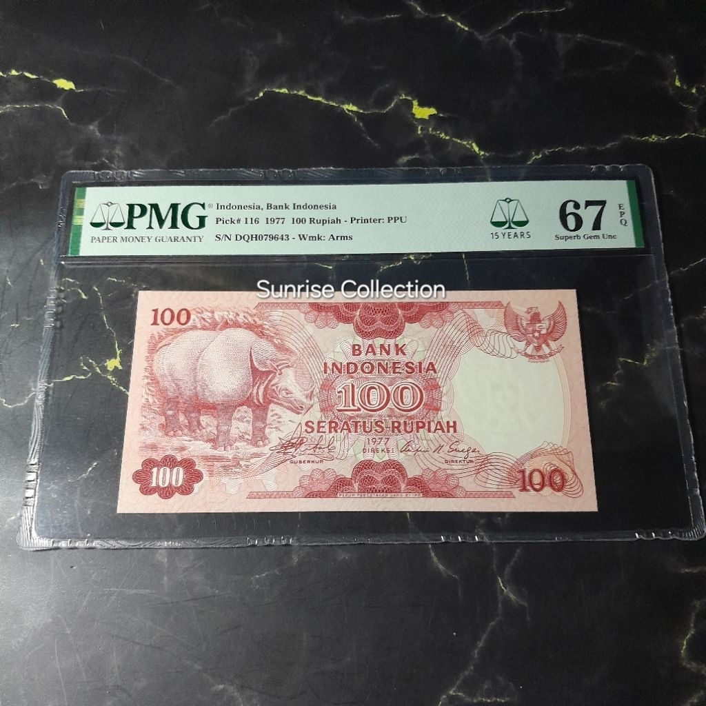 Uang Kuno Indonesia PMG 67 EPQ 100 Rupiah Badak Tahun 1977