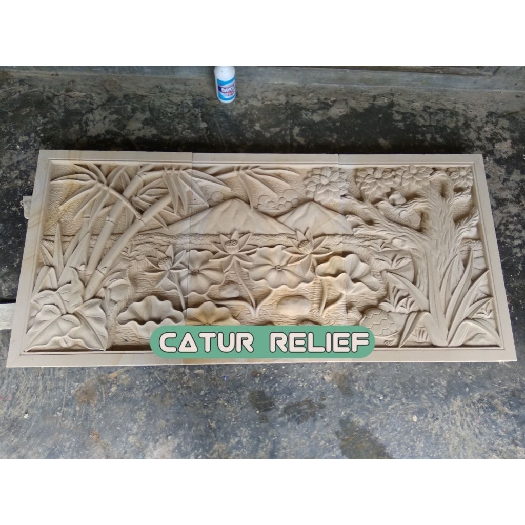 Batu ukir relief motif pemandangan ornamen ukir