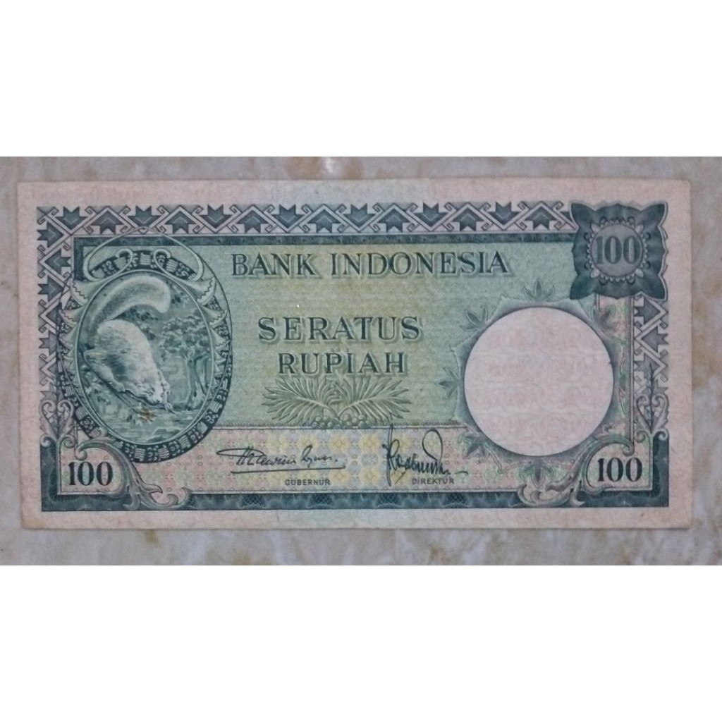 duit kuno asli indonesia 100 tupai tahun 1957 kondisi bagus xf ada bekas lipatan dikit, matauang lam