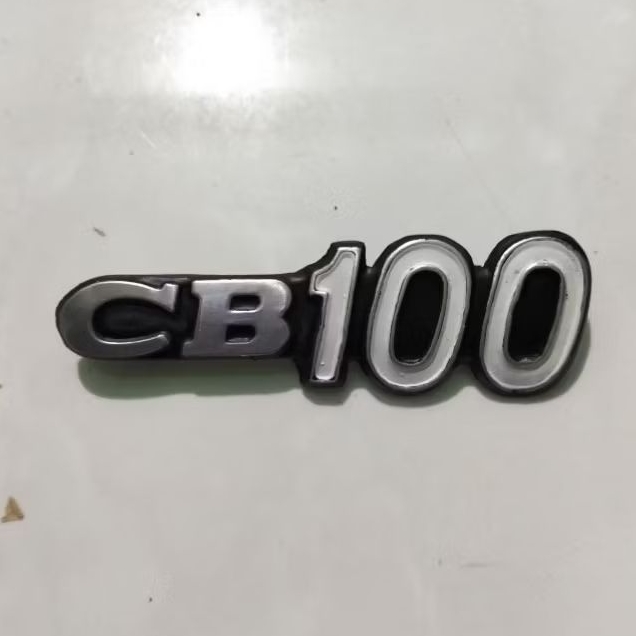 Emblem tutup aki motor Honda CB 100
