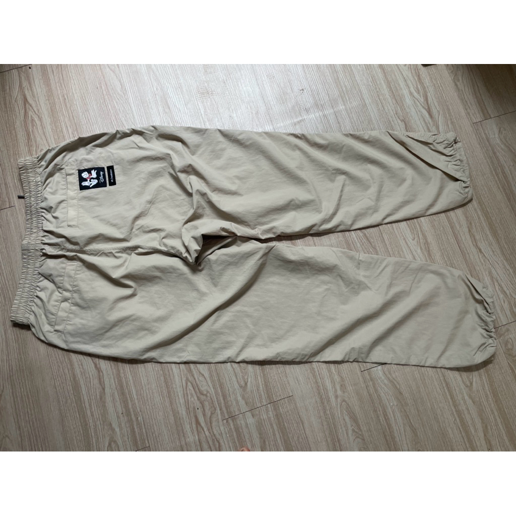 celana panjang merk uniqlo X disney ambush