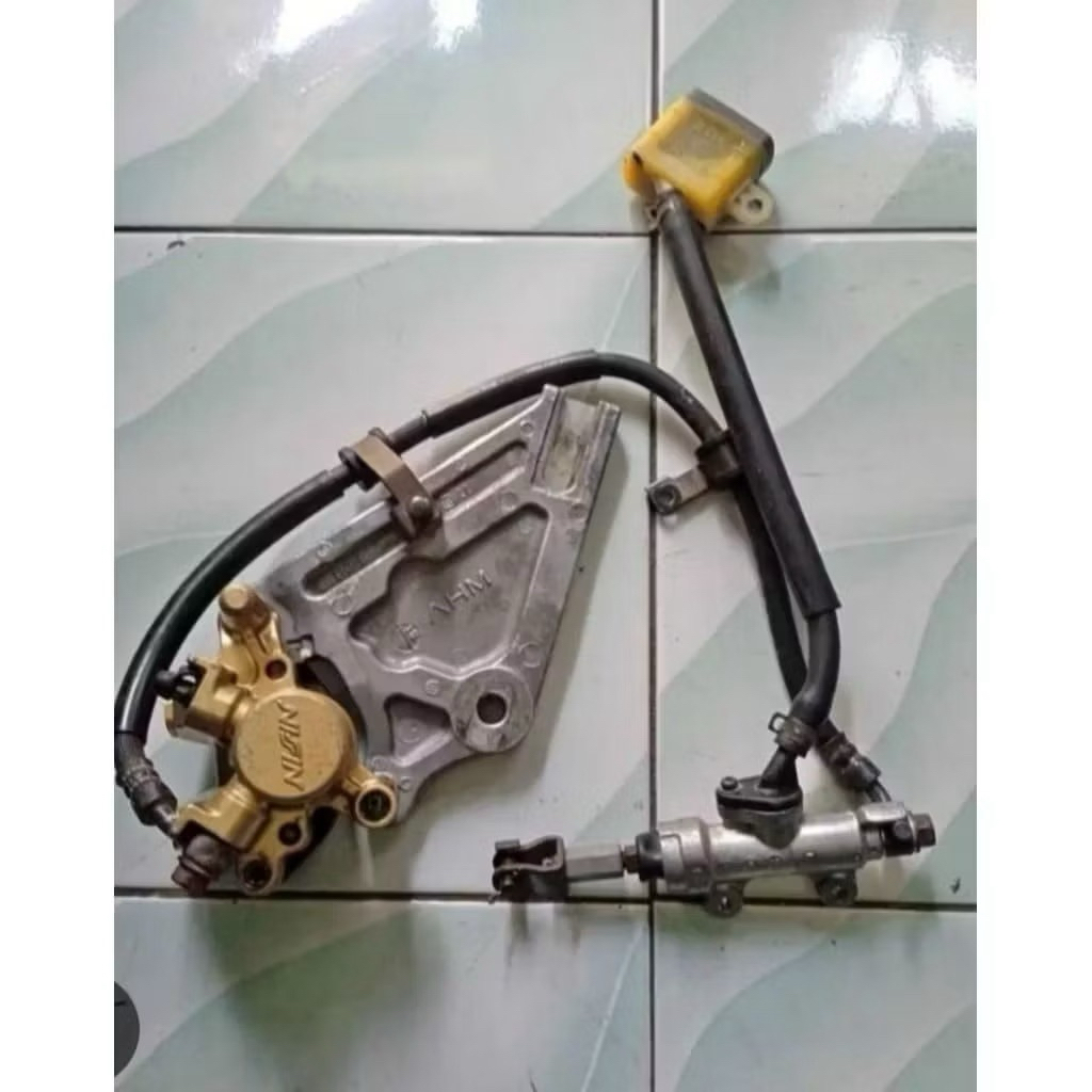 Pengereman set Supra X 125 Cakram Belakang original copotan