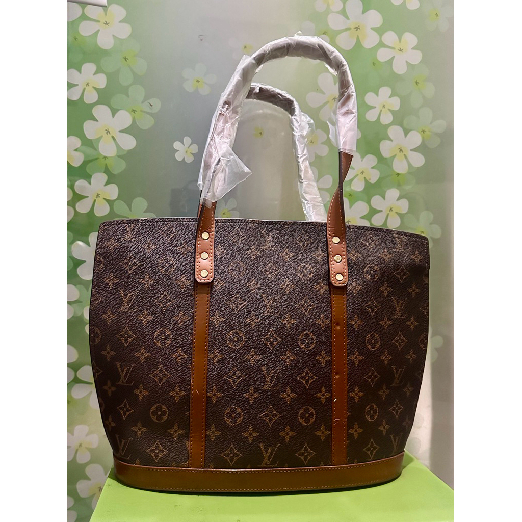 LV - Preloved tas Louis Vuitton Babylone Tote Bag in the classic Monogram canvas.