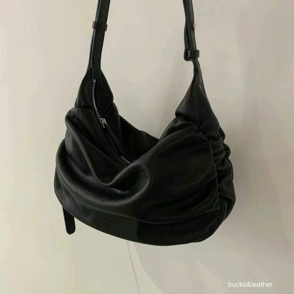 BUCKS AND LEATHER SLING BAG