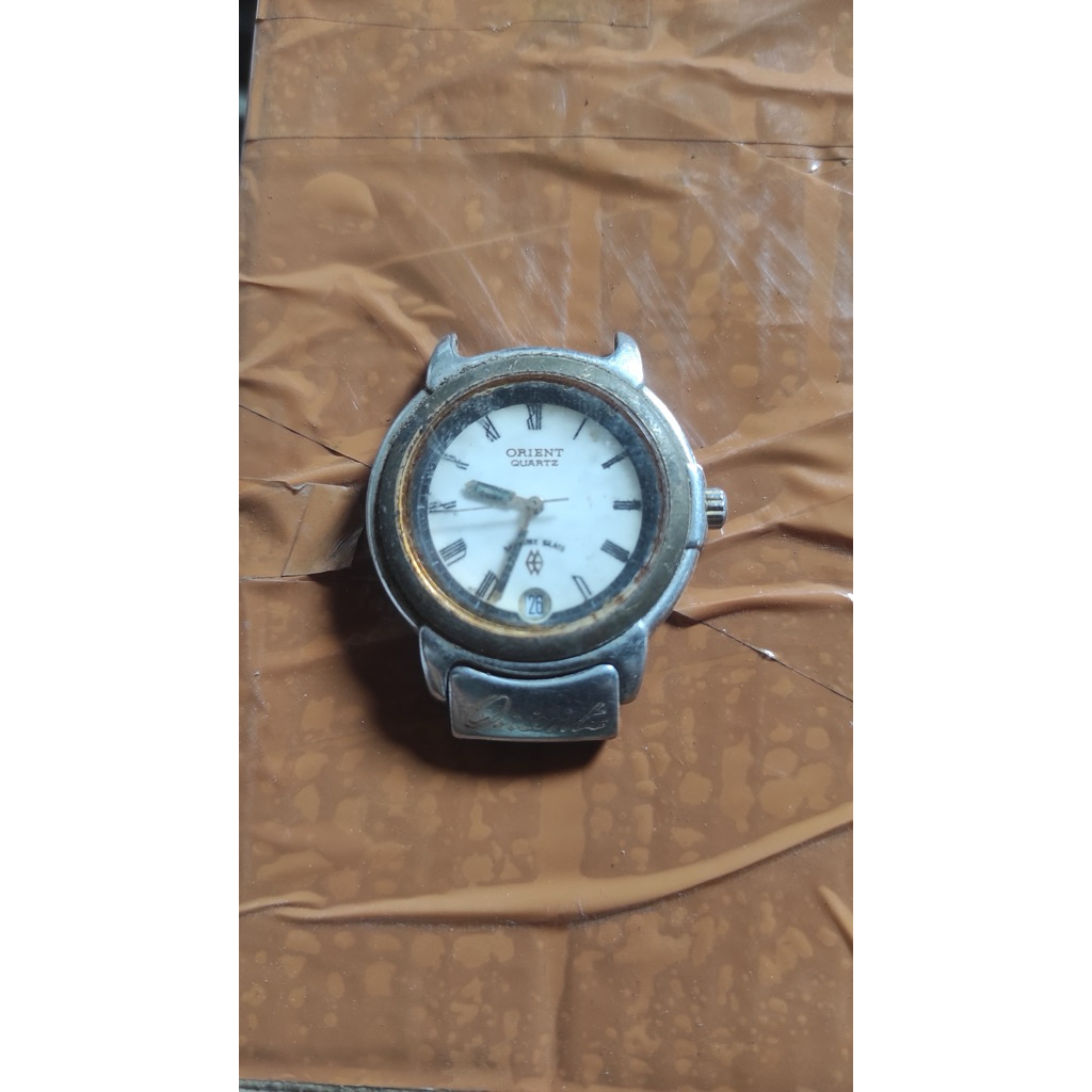 (BAHAN)Orient Jam Tangan Pria Quartz dengan Tampilan Romawi dan Desain Klasik