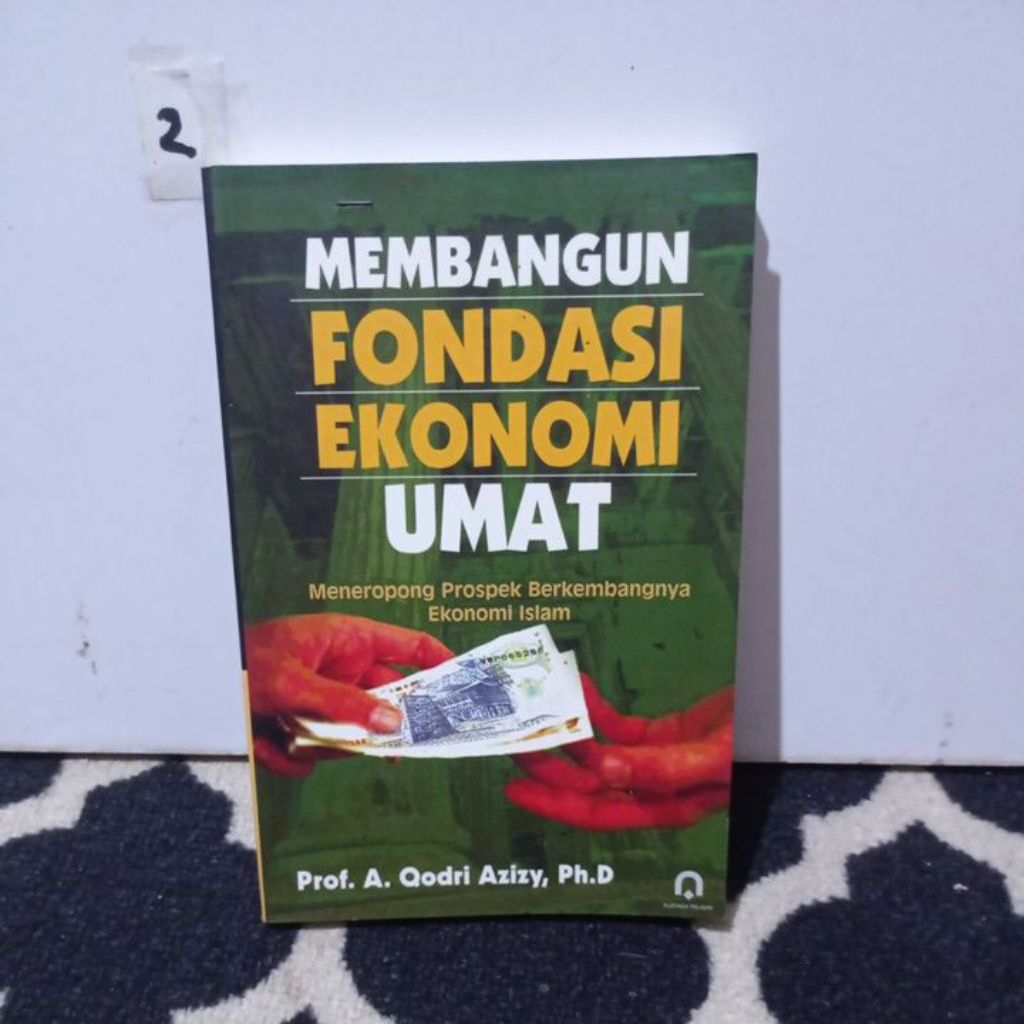 BUKU MEMBANGUN FONDASI EKONOMI UMAT.     PROF. A. QODRI AZIZY,  Ph. D