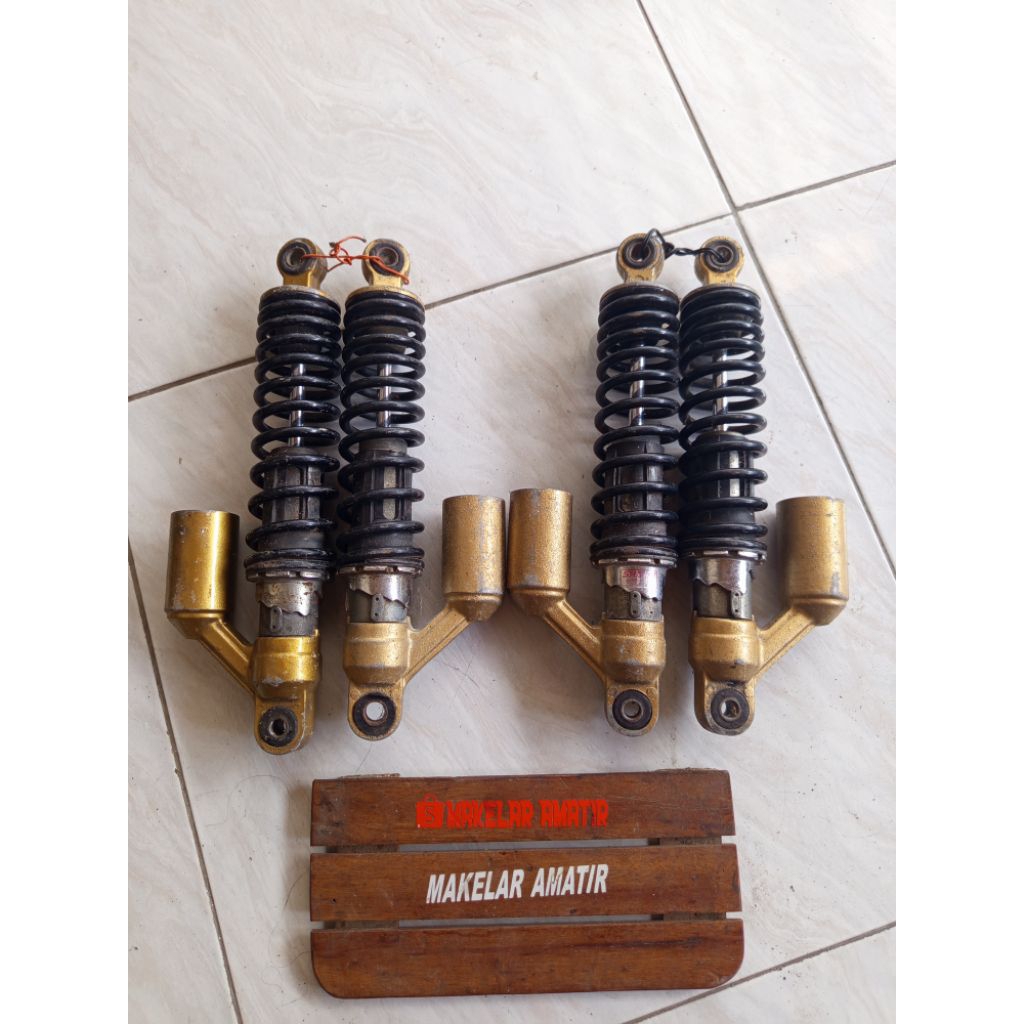 shock belakang tiger revo original copotan