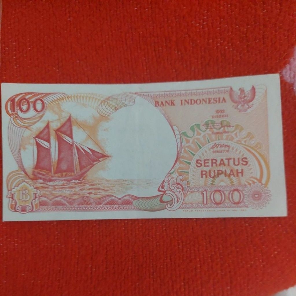 100 rupiah perahu pinisi 1992 cetak geser.