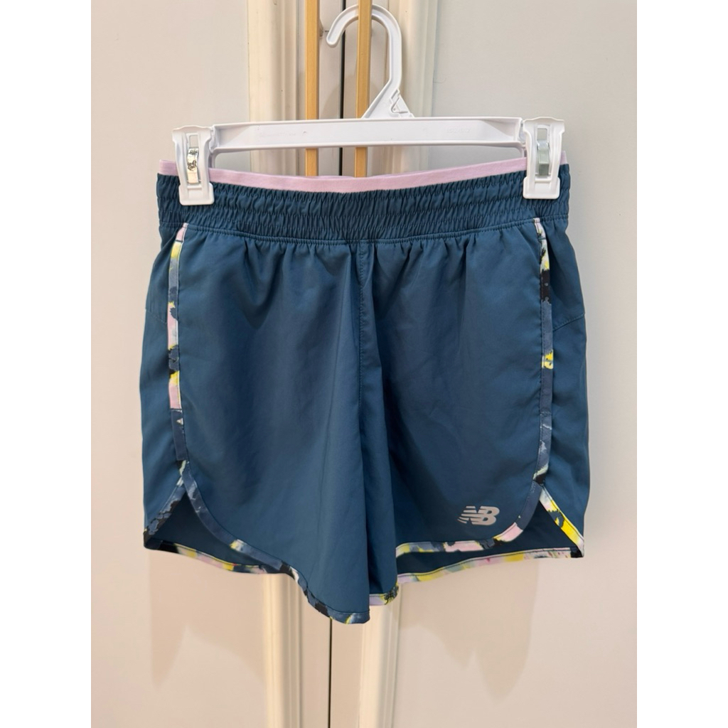 New Balance running short