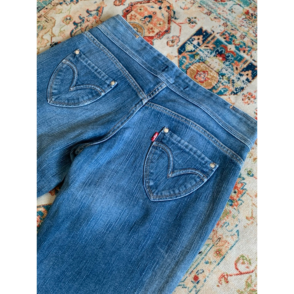 Low rise Levi’s “Charlie Anne” Heart Pocket Bootcut Jeans