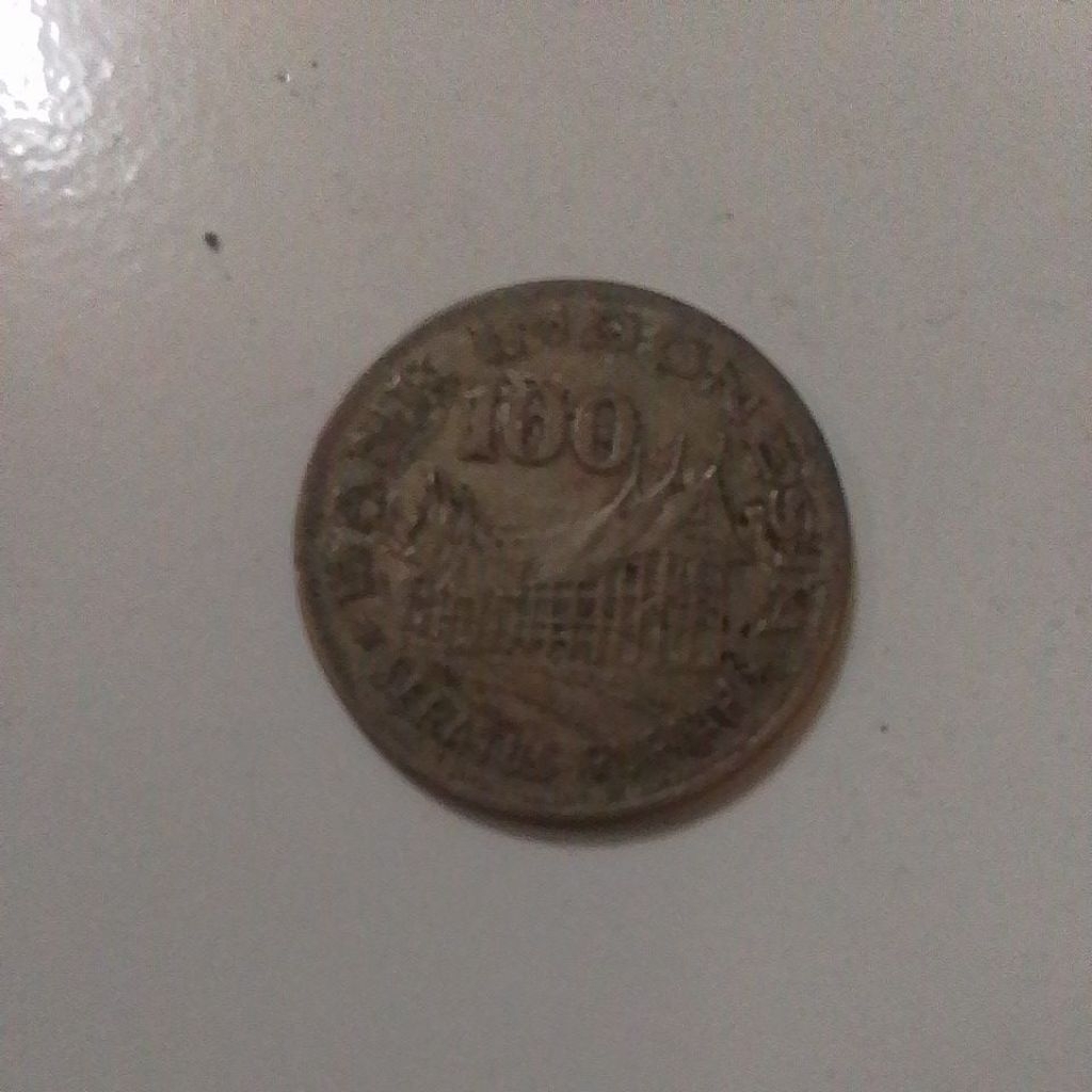 koin 100 rupiah rumah gadang