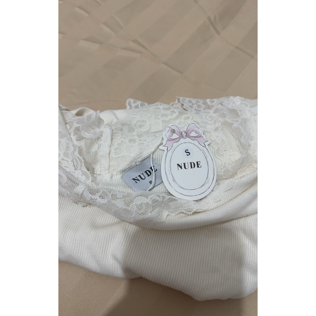 nude the label