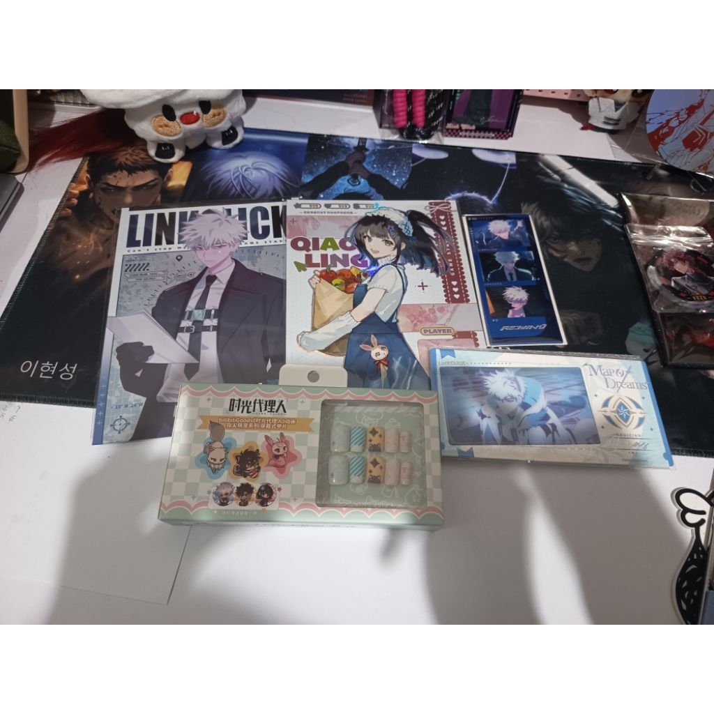Link Click Merch artboard, postcard, press on nail set, plush