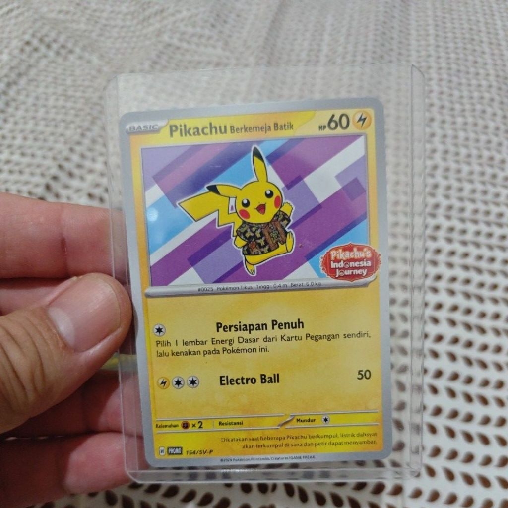 Kartu pokemon pikachu kemeja batik ungu