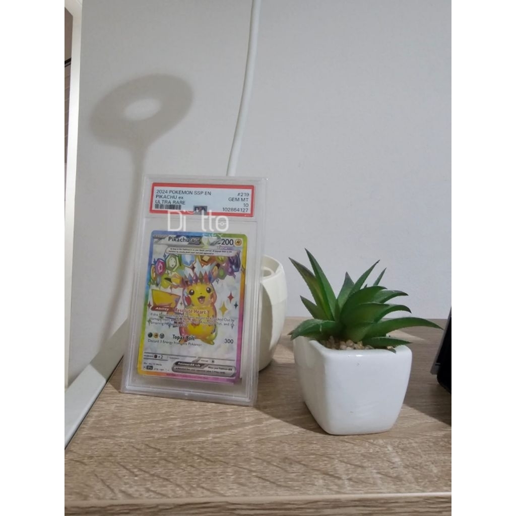 Pikachu ex #219 versi inggris dari surging spark psa 10 UR