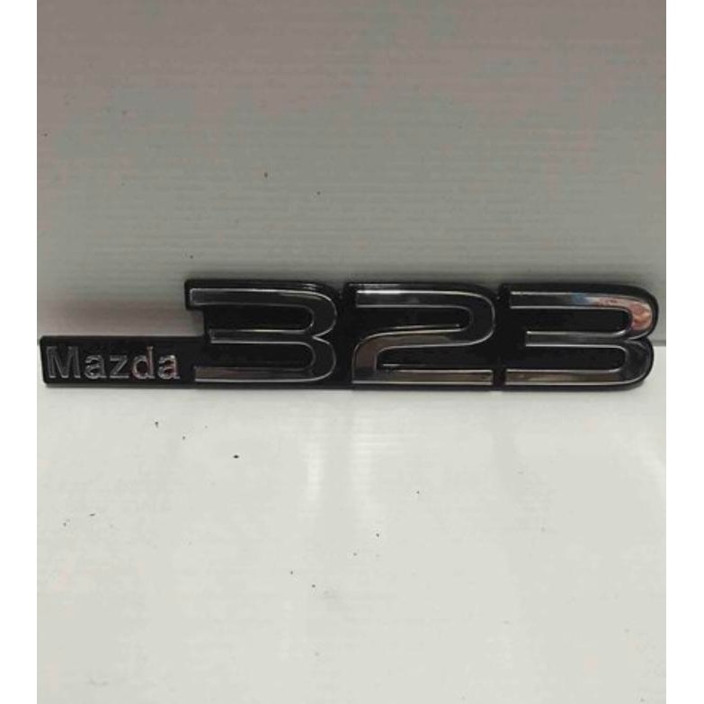 Logo/emblem mazda 323