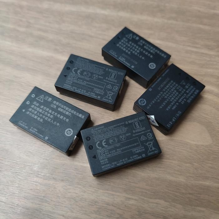 THE BEST BATERAI CANON LP-E12 BATRE ORI BEKAS LPE12 100D M2 M50 M10 M100 EOSM KODE 1302