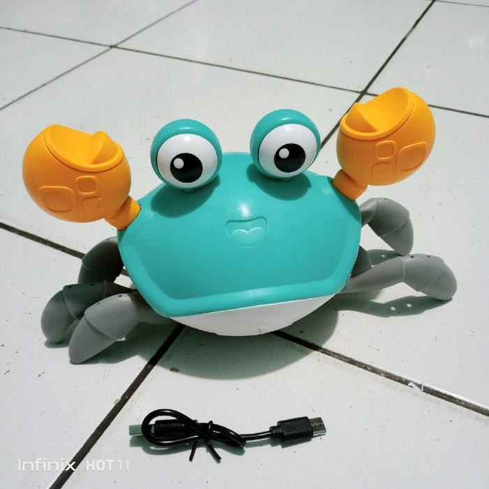 MAINAN KEPITING SENSOR CAS LAMPU DAN MUSIK