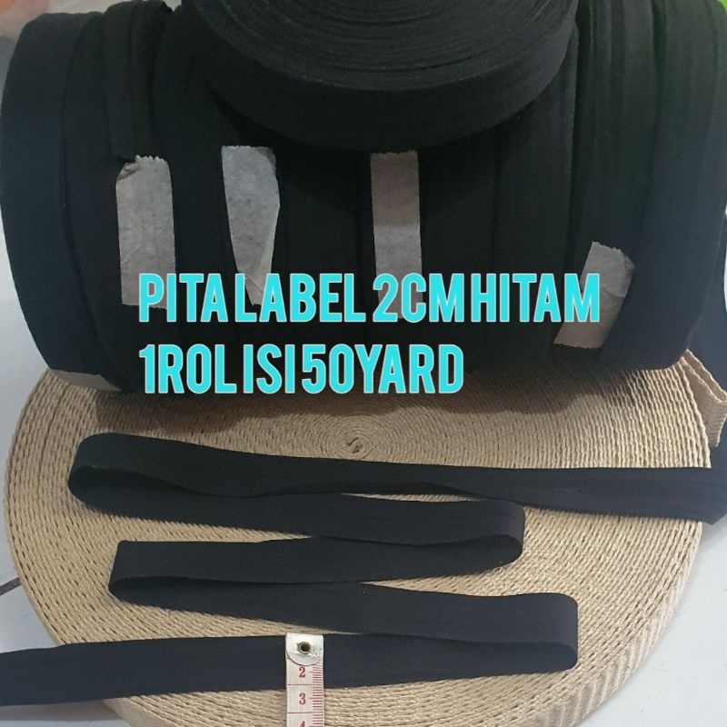 

Pita Label Hitam 2Cm Bahan Halu,Tipi Dan Lembut 1Rol Ii 50Yard