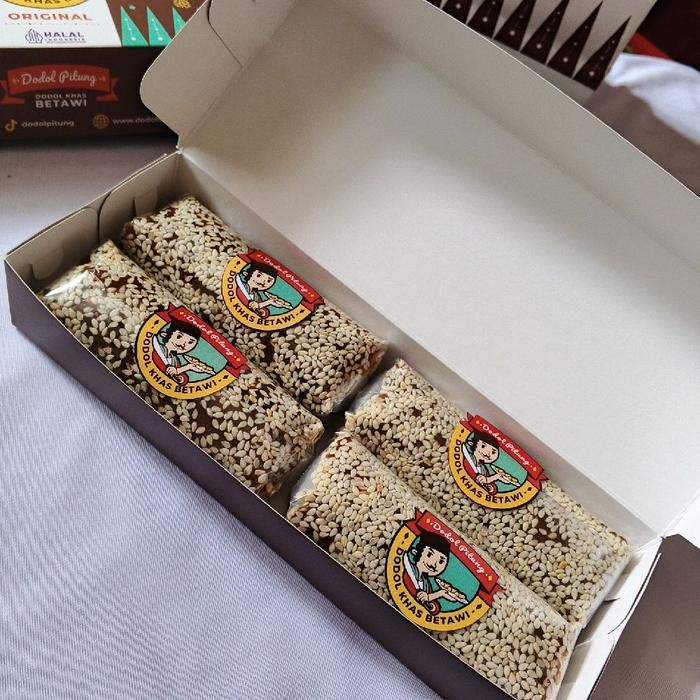 

dodol betawi lonjor kecil isi 4 lonjor kecil / mini 1 pcs 100 gram isi 4 total berat 4 pcs 400 gram