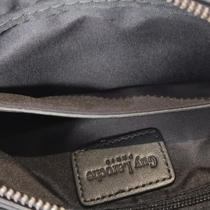 tas clutch pria merk Lacoste