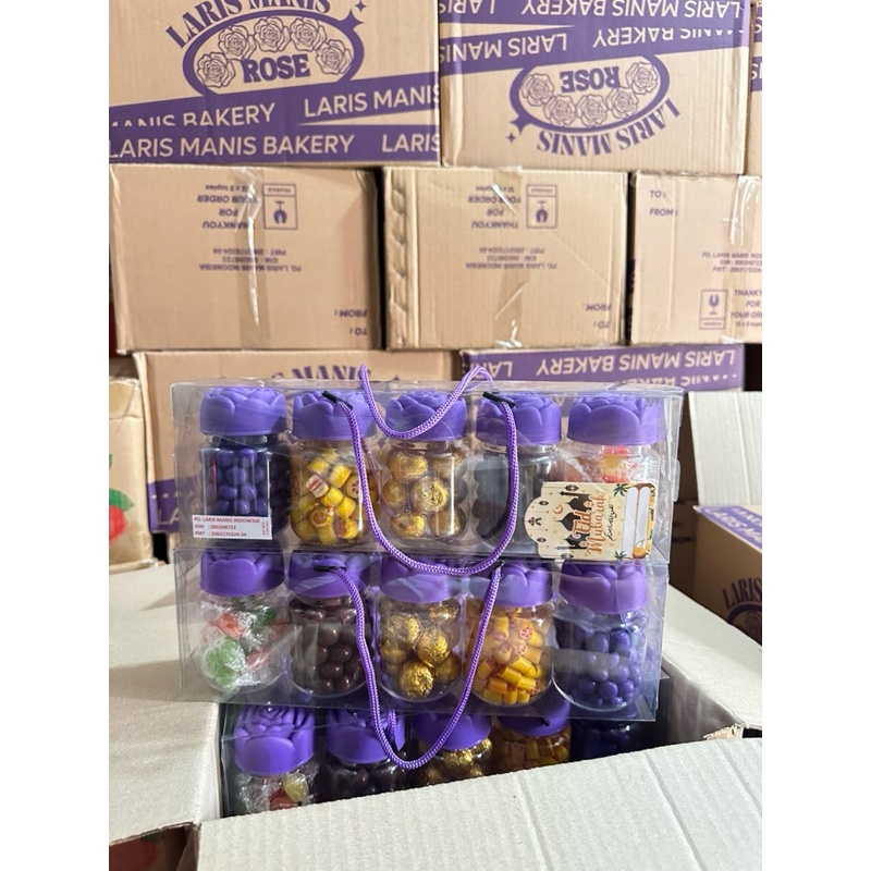 

NEW DEALS HAMPERS COKLAT MAWAR UNGU ISI 5 TOPLES CANDY ROSE