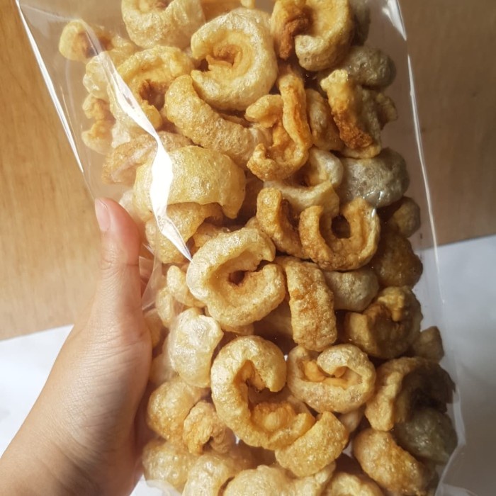 

BARANG TERLARIS kerupuk babi/krubi/kerupuk kulit babi samcan opig 250gr