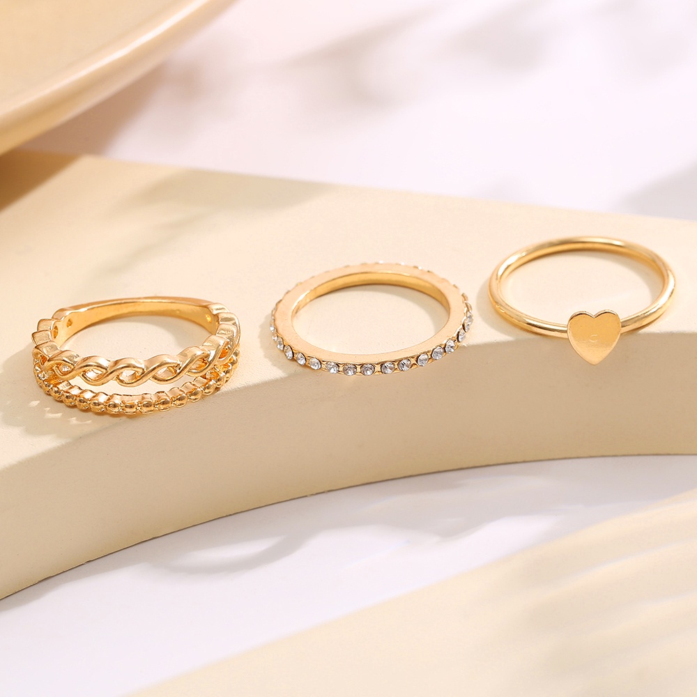 3pcs / set Cincin Model Twist Hollow Bentuk Hati Aksen Kristal Warna Emas Untuk Wanita