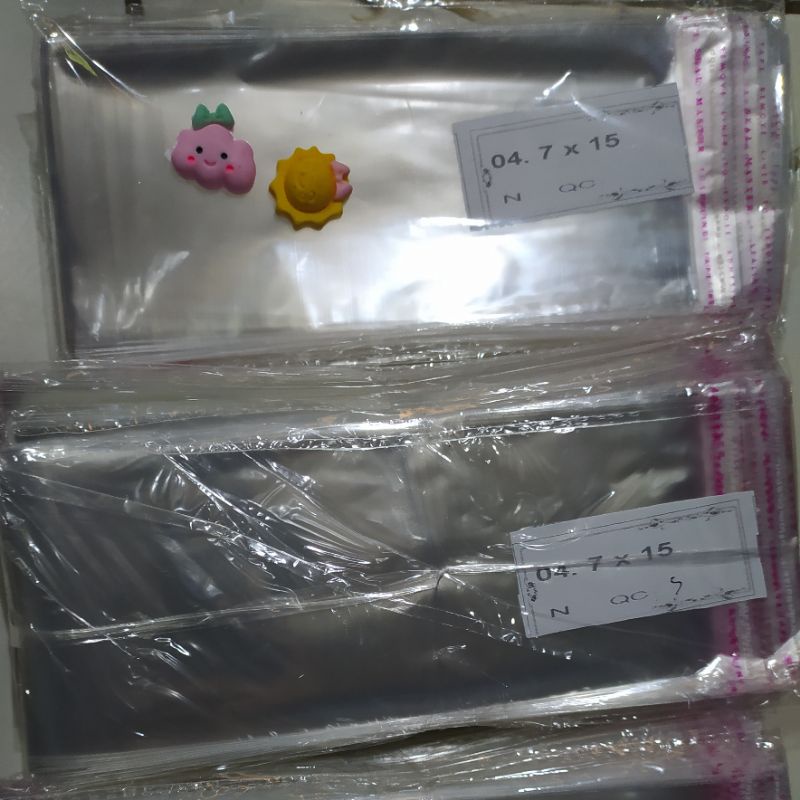 

PLASTIK OPP 7 CM x 15 CM (dengan lem 7x15) plastik uang plastik buket
