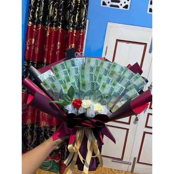 buket uang 20rb/money bouquet. 25 lembar
