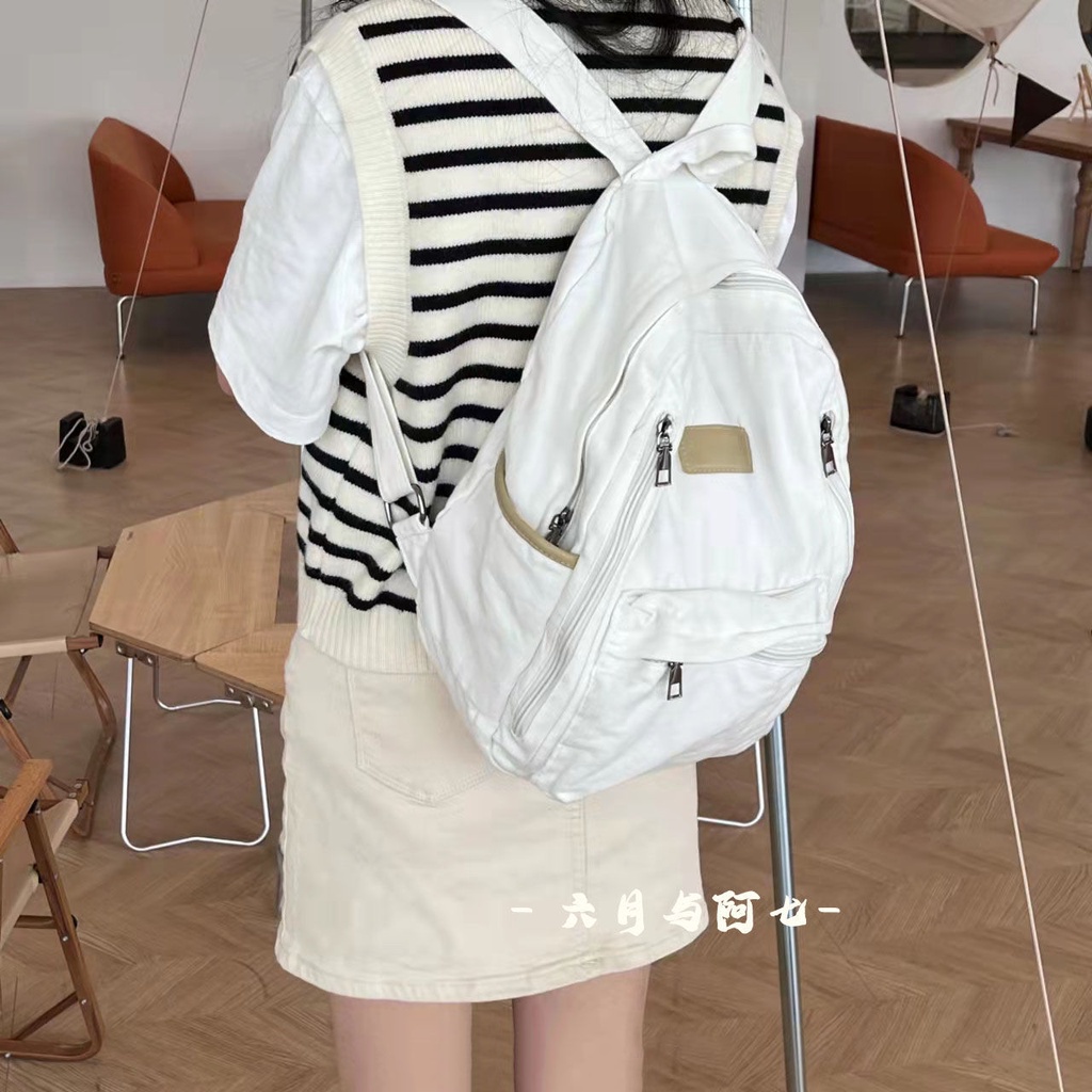 ✒♝Sera Sera diimpor perguruan tinggi Jepang gaya malas tua dicuci putih kanvas tas sekolah siswa gaya sederhana liontin putih ransel kanvas